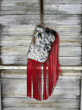 Load image into Gallery viewer, Black and White Cowhide Jessica Wristlet with Red Fringe
